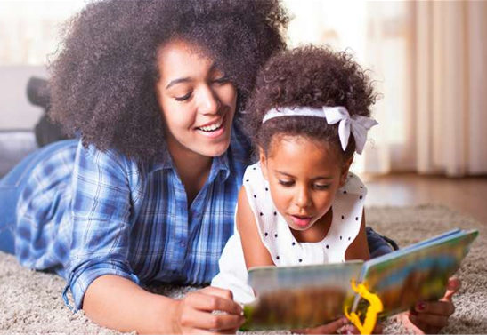 Mother reading to her child. Building Kindergarten readers information.  